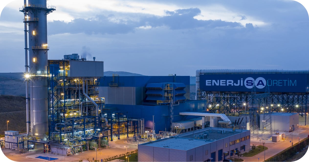 Enerjisa Üretim power plant lit up at dusk